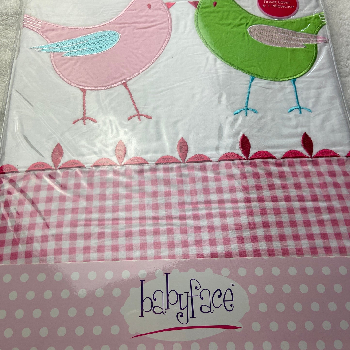 Baby duvet cover set with bird designs on a white background