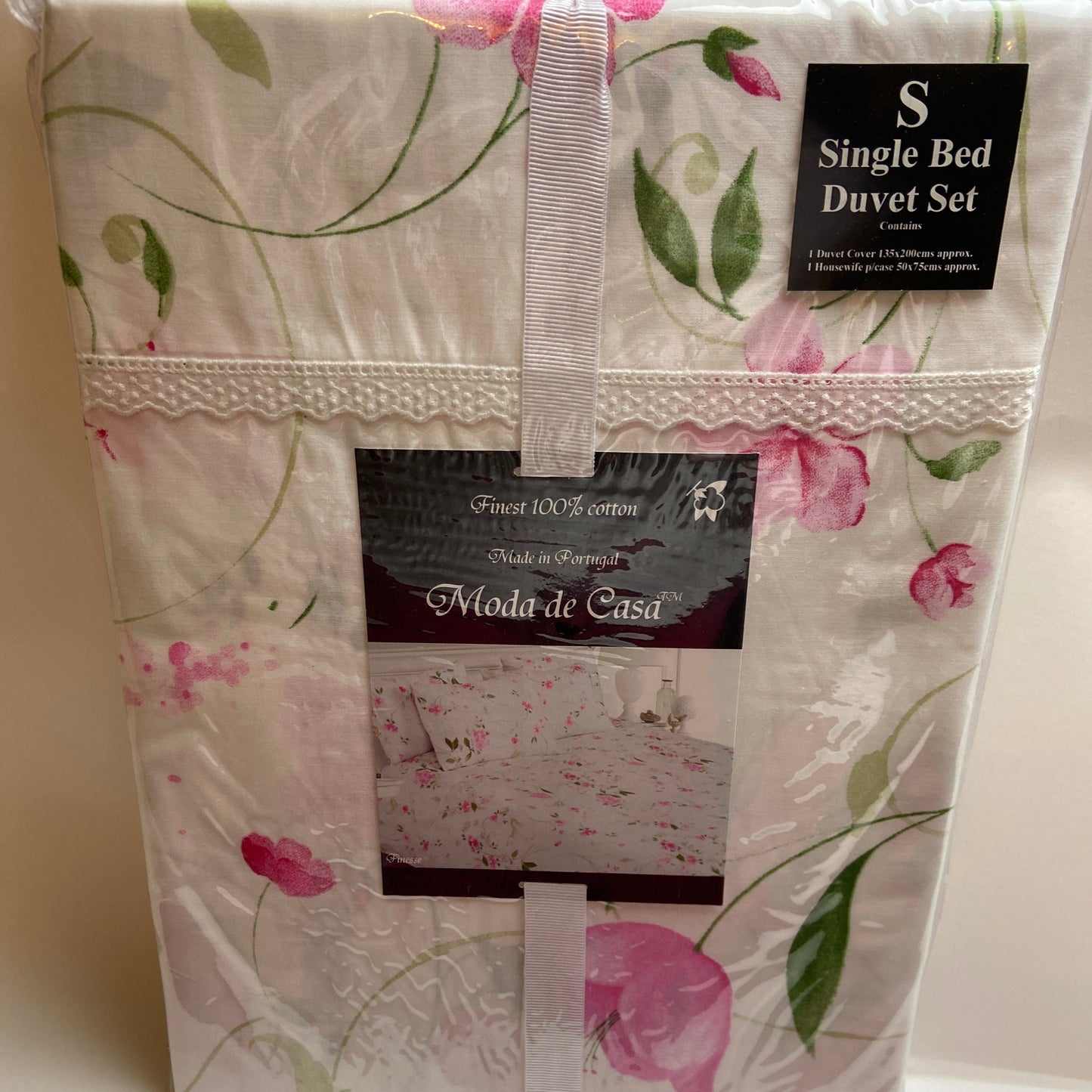 Floral patterned duvet set with brand label on a white background