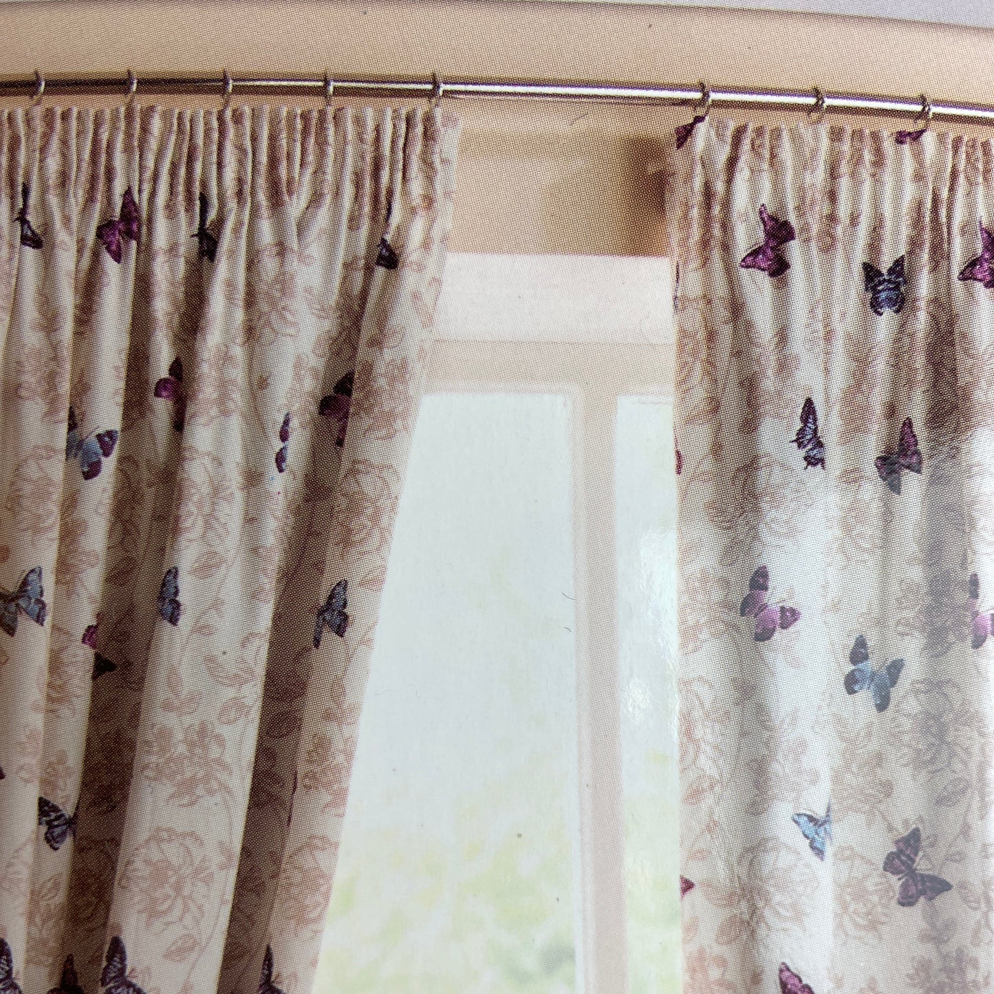 Pencil pleat curtains featuring butterflies with floral detail