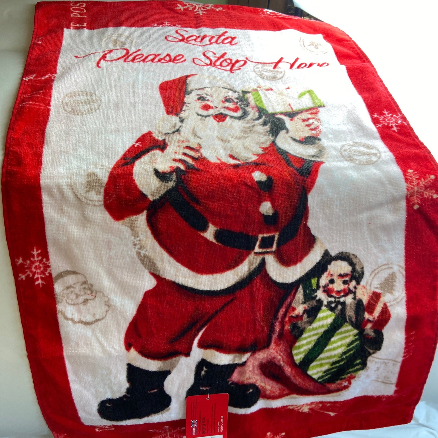 Retro Santa Hand Towel by Catherine Lansfield