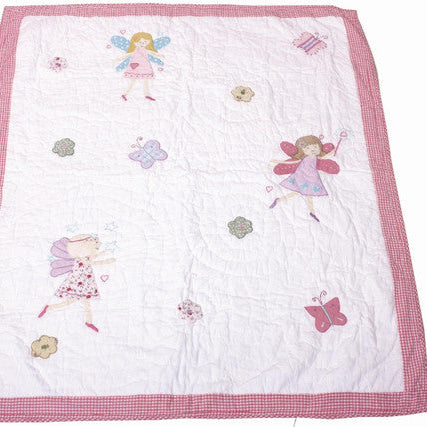 Quilt with fairy designs on a white background