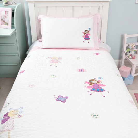 Children's bedroom with fairy-themed bedding and decor