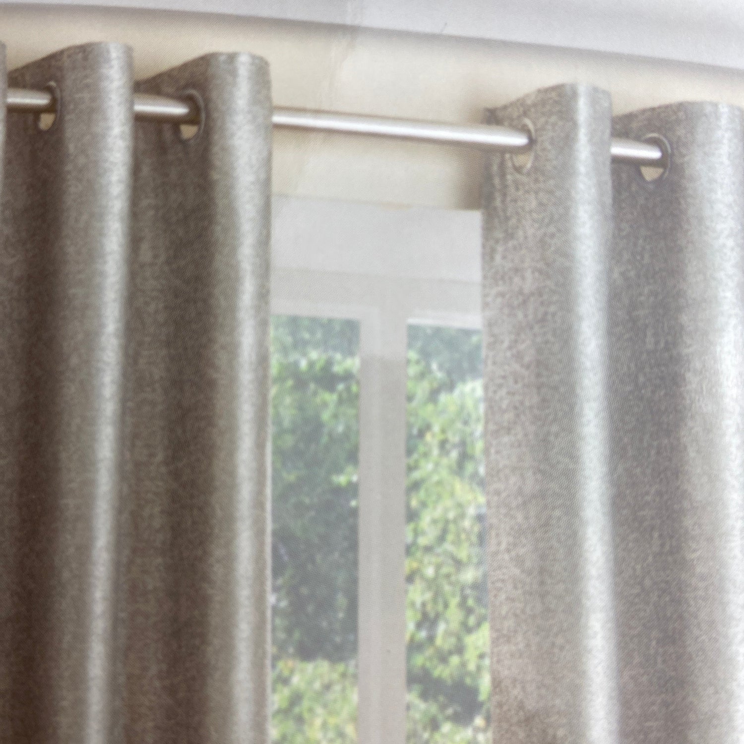 Luna Silver Eyelet Curtains by Belfield Furnishings. One pair of fully lined eyelet curtains featuring a shimmering silver design set on a grey background. Face &amp; Lining 100% polyester.