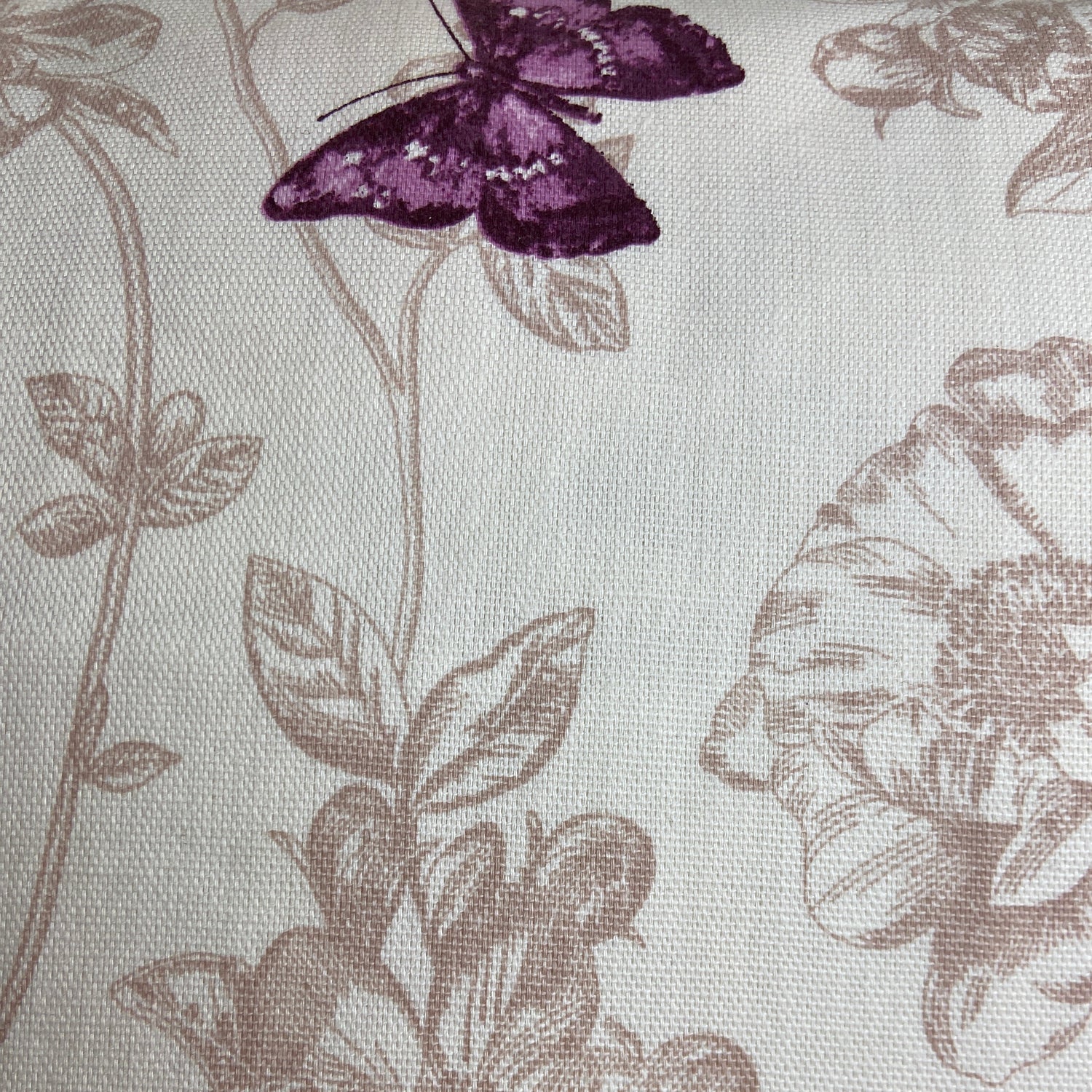 Fabric with floral and butterfly pattern on a light background