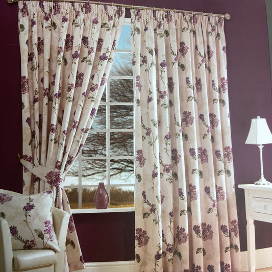 Salisbury Pencil Pleat Fully Lined Curtains with Tiebacks by Contemporary Collections. Floral design set on a cream background with aubergine, green, pink and pale taupe colours. Front 86% polyester, 14% cotton. Lining 80% polyester, 20% cotton. Tiebacks to match included.