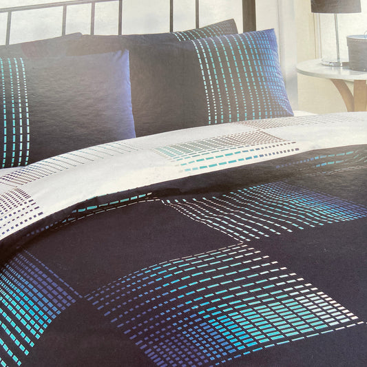 Dash Navy Duvet Set by Dreams N Drapes. Set on a navy background with blue dashes that create square design with the reverse set on a white background, making it fully reversible. 52% polyester 48% cotton.