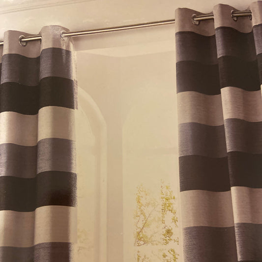 Bromley Eyelet Curtains by Ashley Wilde. These fully lined eyelet curtains in chenille with dark slate, grey and light grey broad stripe design. Face and lining 100% polyester.