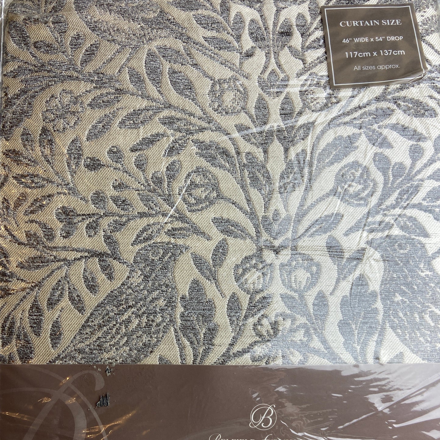 Decorative curtain fabric with a leaf pattern and 'Luxury' branding on packaging.