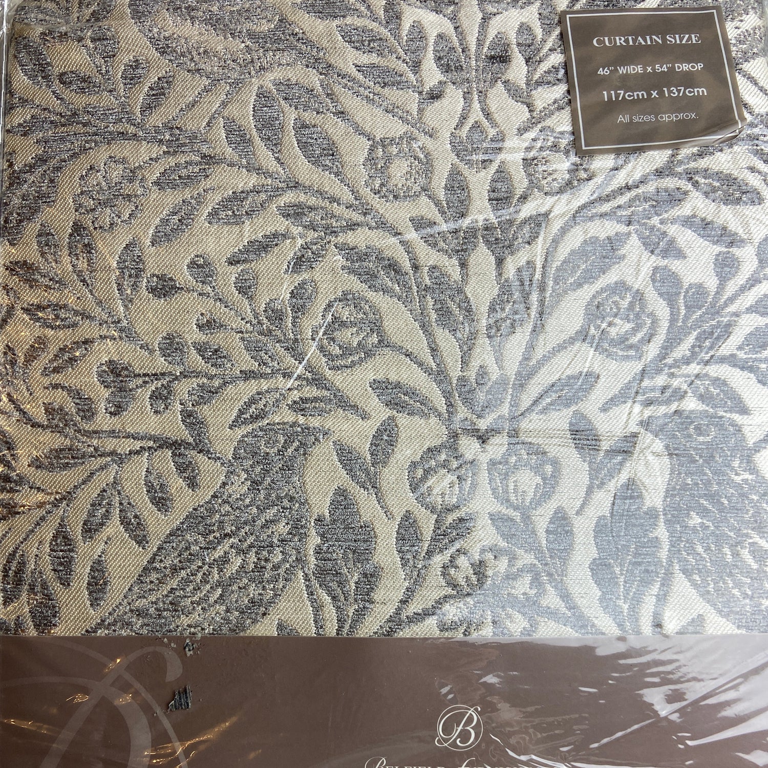 Decorative curtain fabric with a leaf pattern and 'Luxury' branding on packaging.