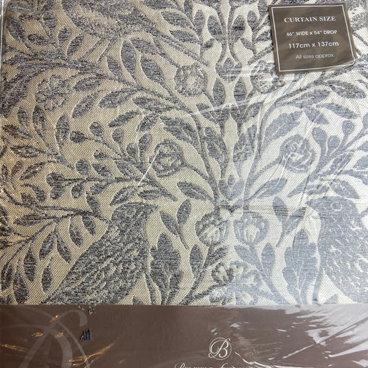 Decorative curtain fabric with a leaf pattern and 'Luxury' branding on packaging.