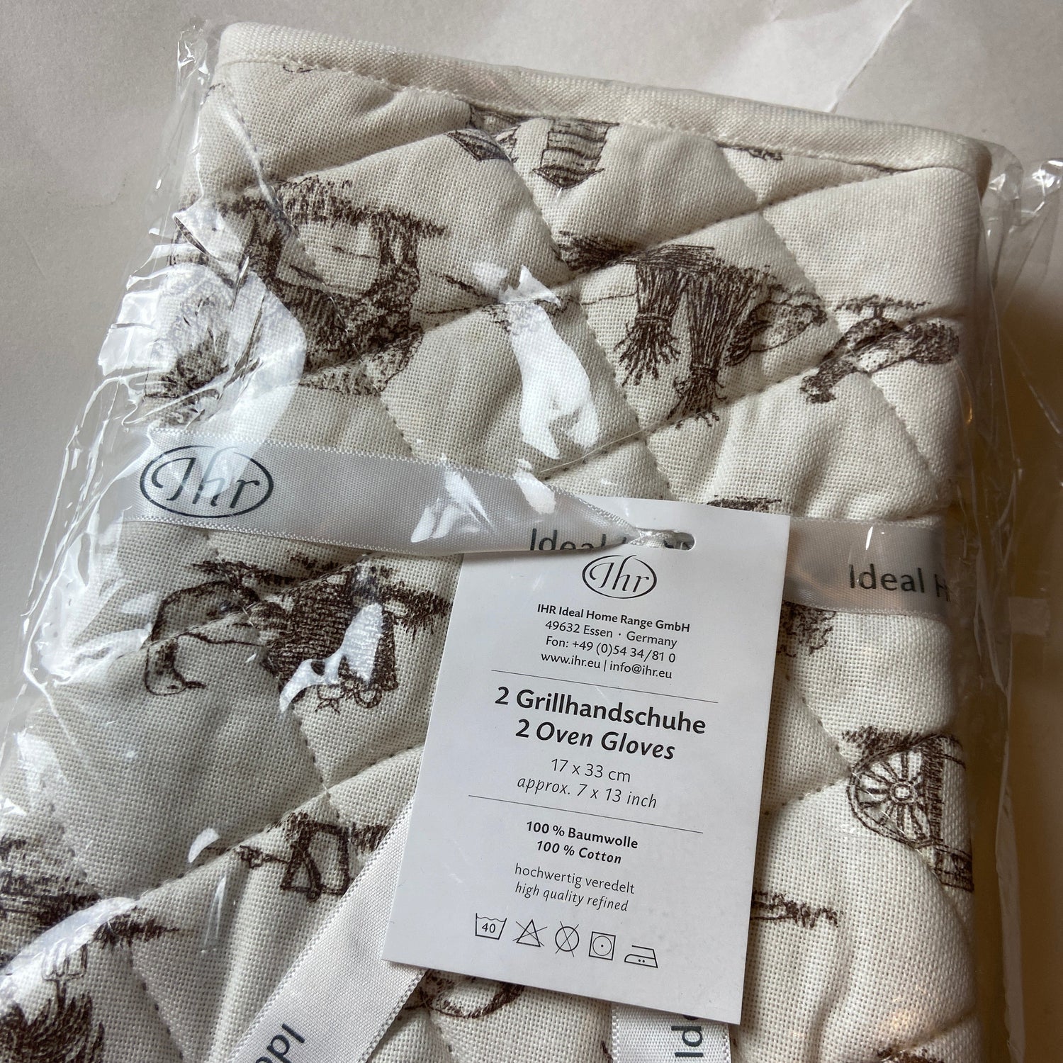 Packaged fabric with a pattern and 'Ideal Home Range' label.