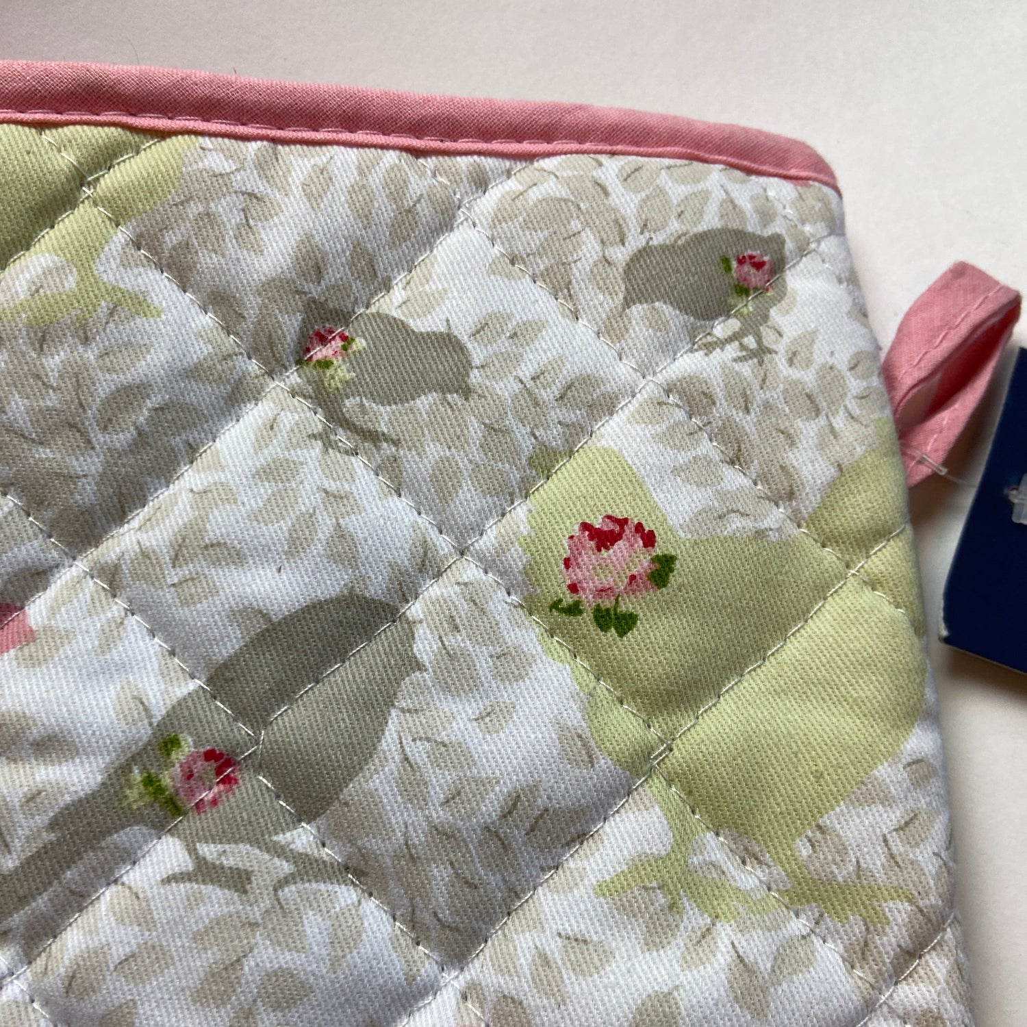 Quilted fabric with floral patterns on a plain background