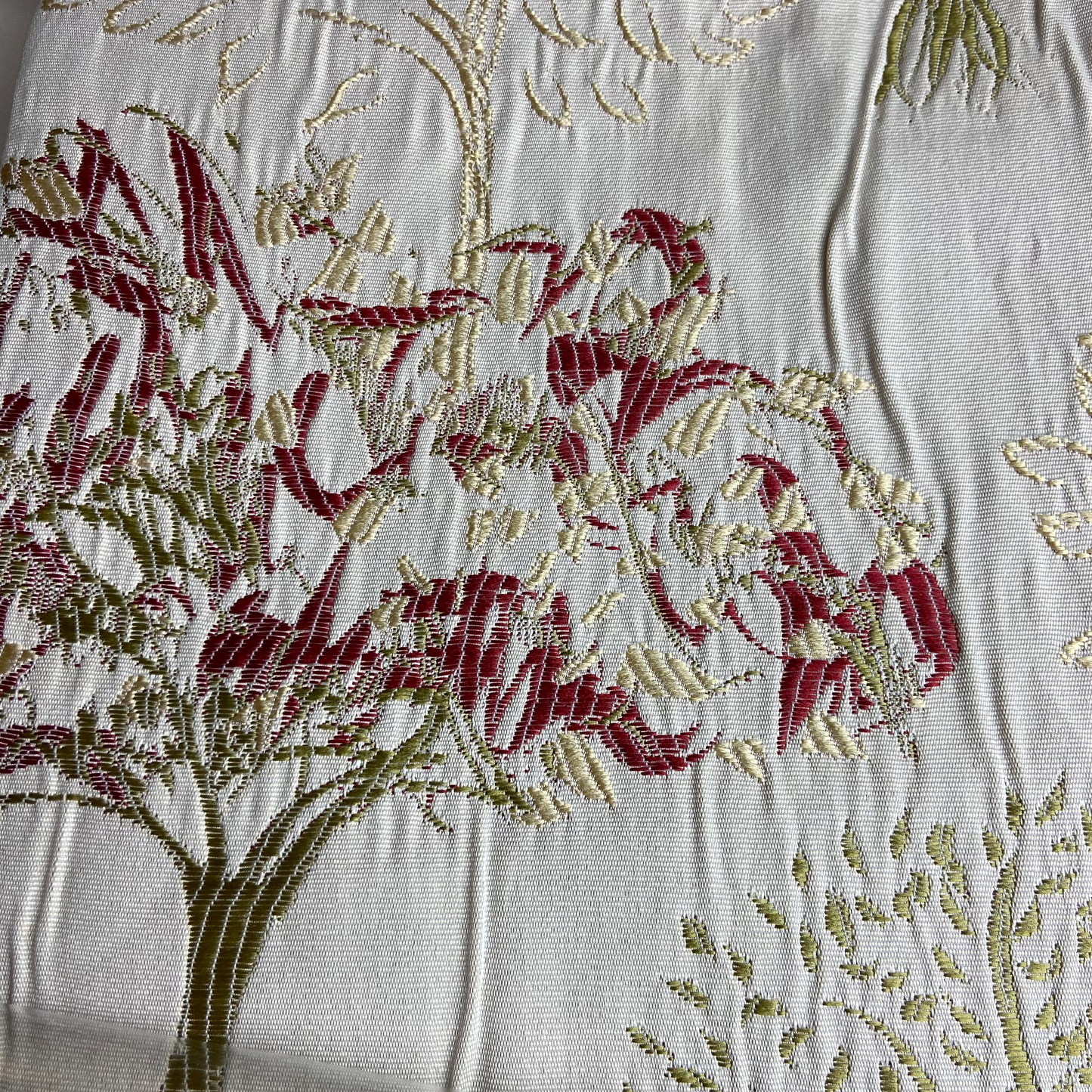 Curtains with embroidered trees on an ivory background